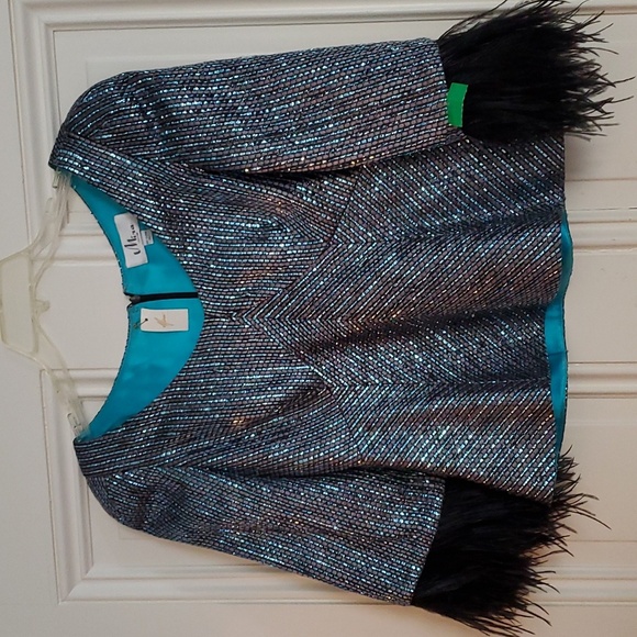 Mira Couture $990 sparkling top with feathers